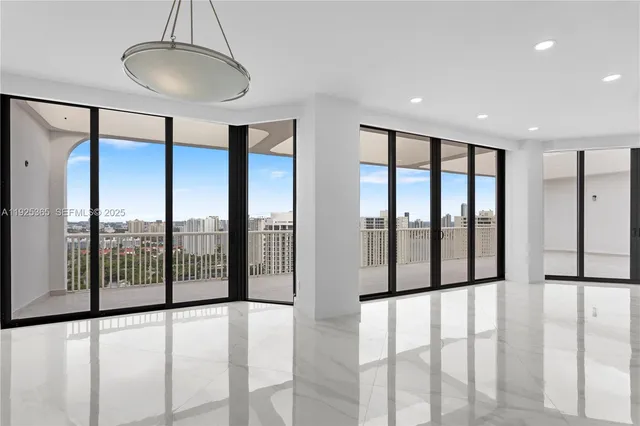 a view of a kitchen and refrigerator