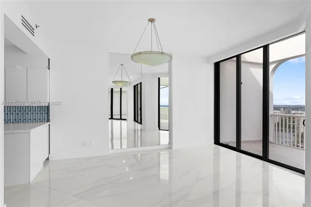 a large kitchen with a large counter top appliances and cabinets