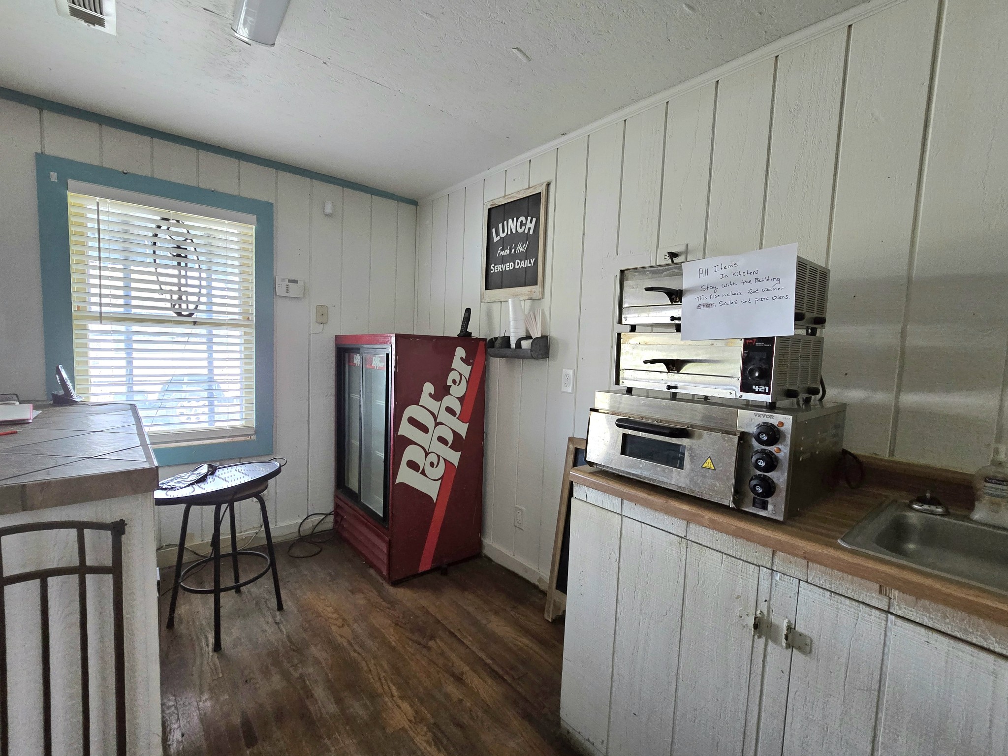 7089 Short Mountain Road McMinnville, TN 37110 - Photo 33 of 36 a kitchen with stainless steel appliances granite countertop a refrigerator and a stove top oven