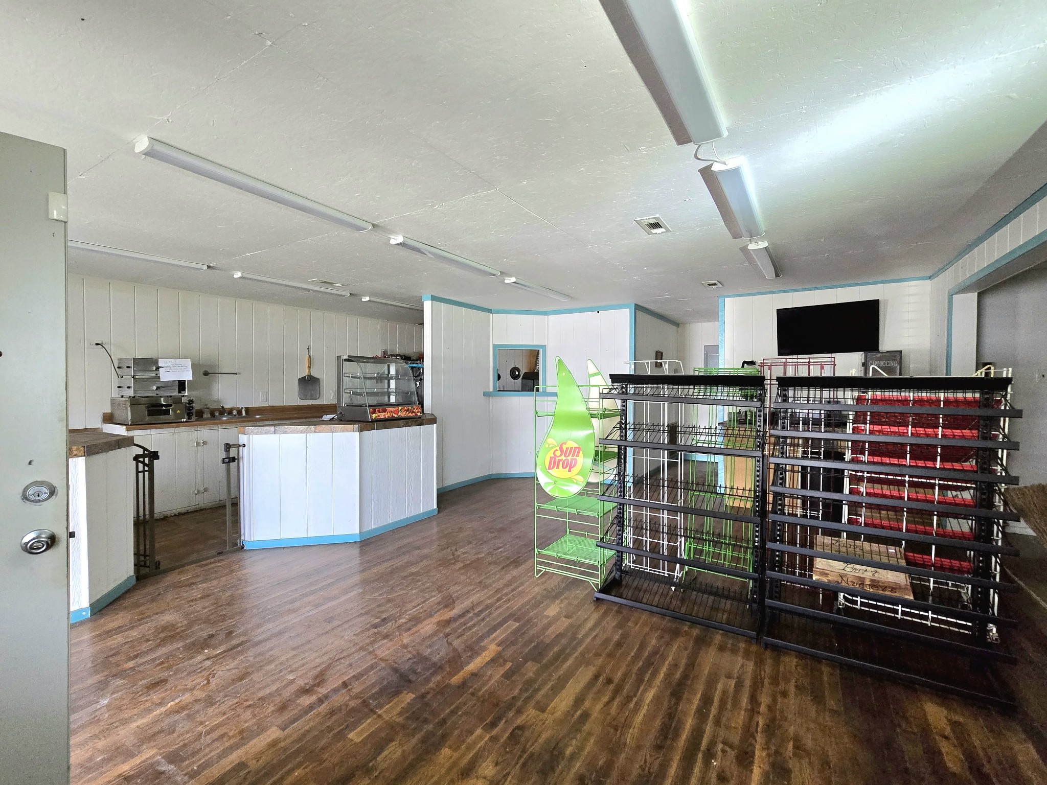 7089 Short Mountain Road McMinnville, TN 37110 - Photo 36 of 36 a kitchen with stainless steel appliances kitchen island granite countertop a refrigerator oven a sink dishwasher and white cabinets with wooden floor