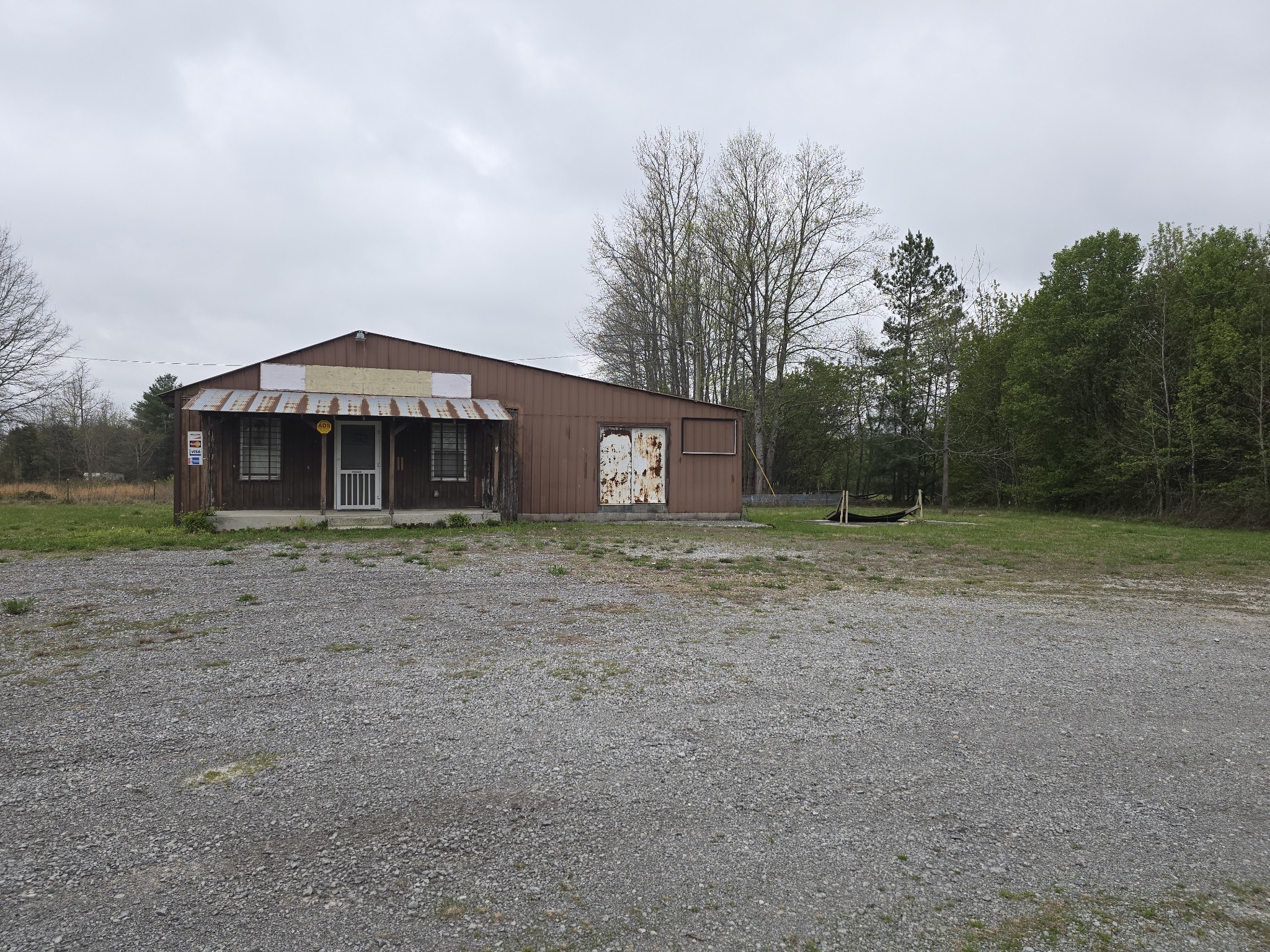7089 Short Mountain Road McMinnville, TN 37110 - Photo 4 of 36 a front view of a house with a yard and trees