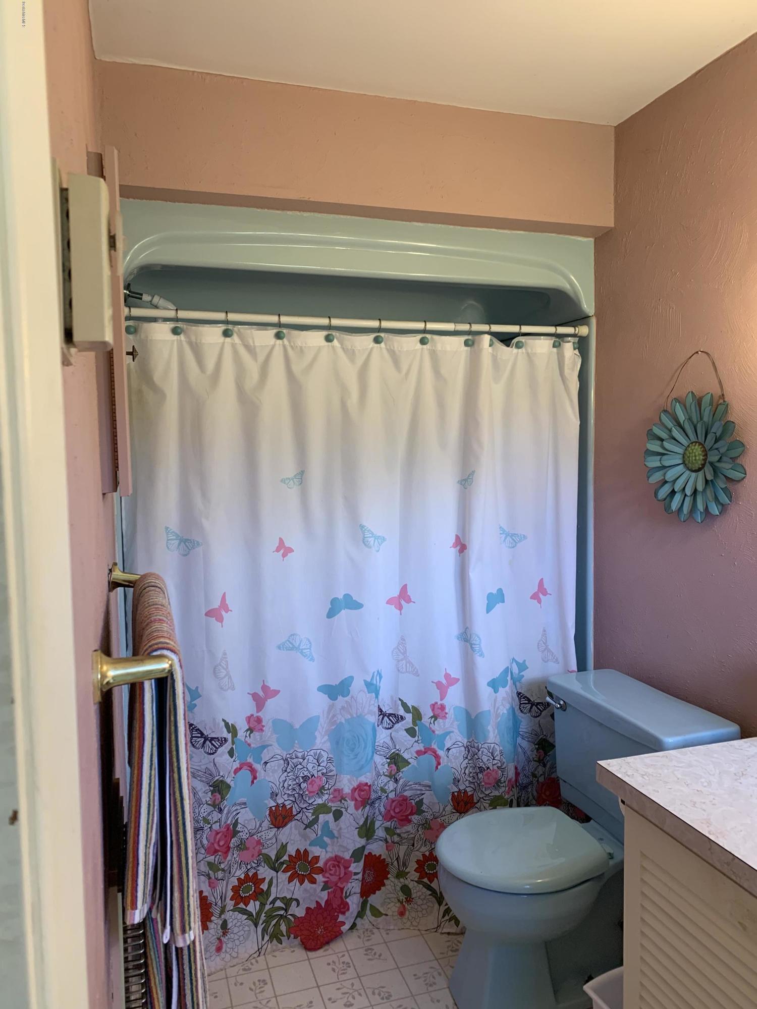 100 Jackson Road Savoy, MA 01256 - Photo 12 of 38 a bathroom with a toilet sink and shower curtain