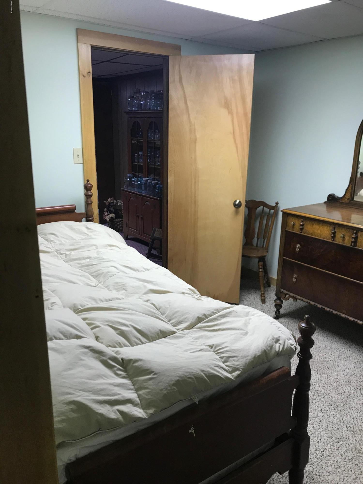 100 Jackson Road Savoy, MA 01256 - Photo 19 of 38 a bedroom with a bed and a dresser