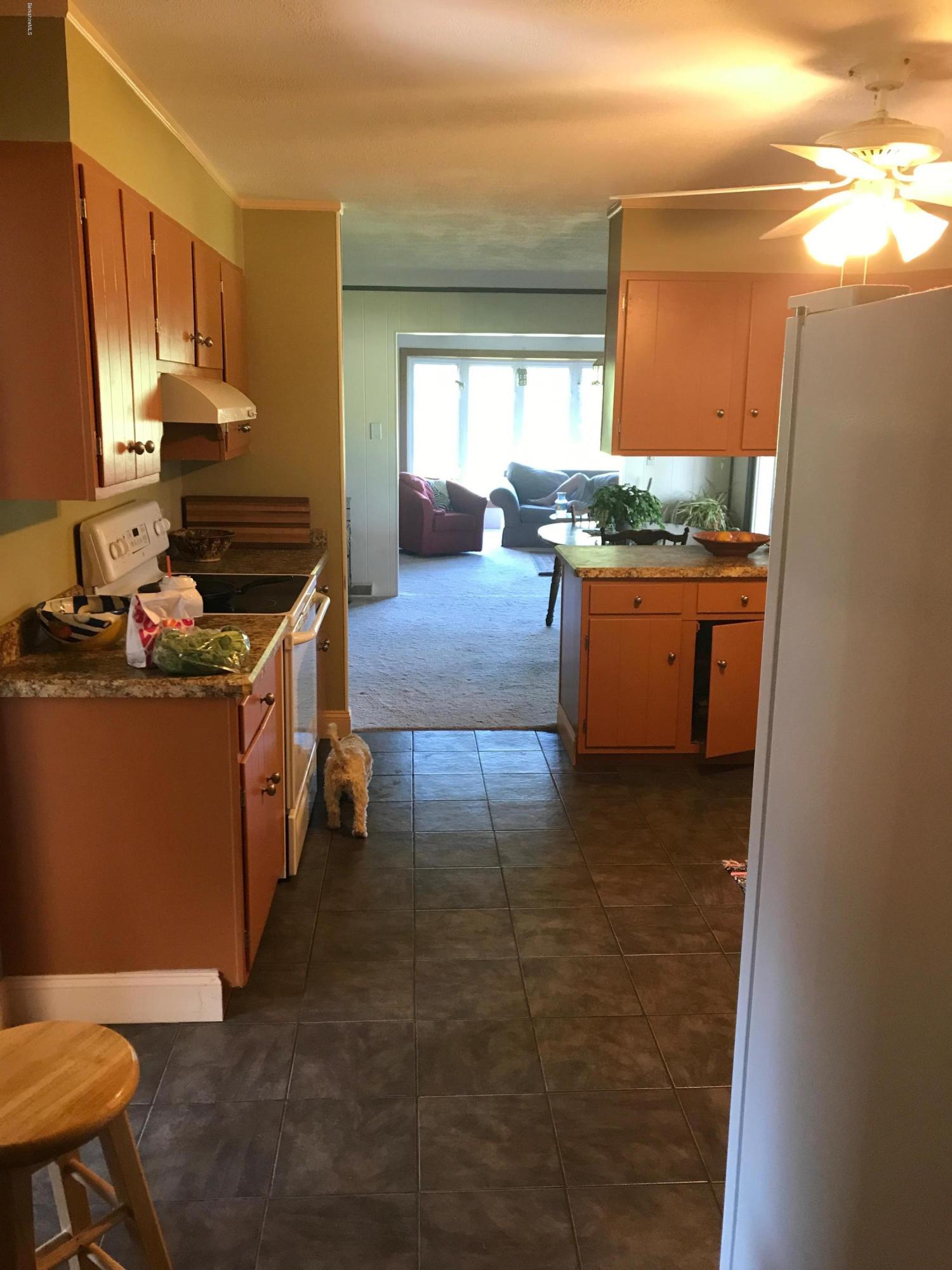100 Jackson Road Savoy, MA 01256 - Photo 5 of 38 a kitchen with stainless steel appliances granite countertop a stove a sink and a refrigerator