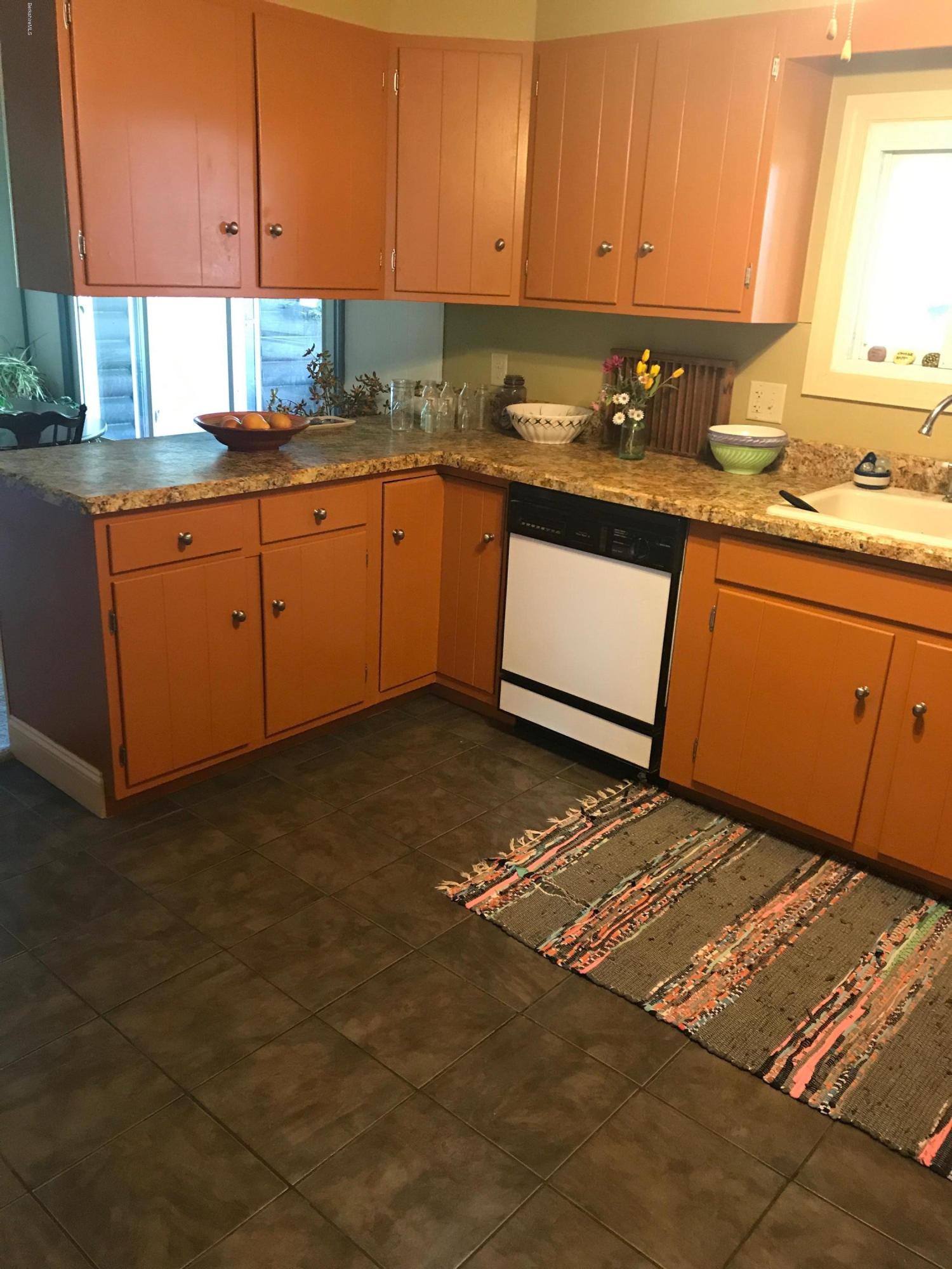 100 Jackson Road Savoy, MA 01256 - Photo 6 of 38 a kitchen with a sink stove and cabinets