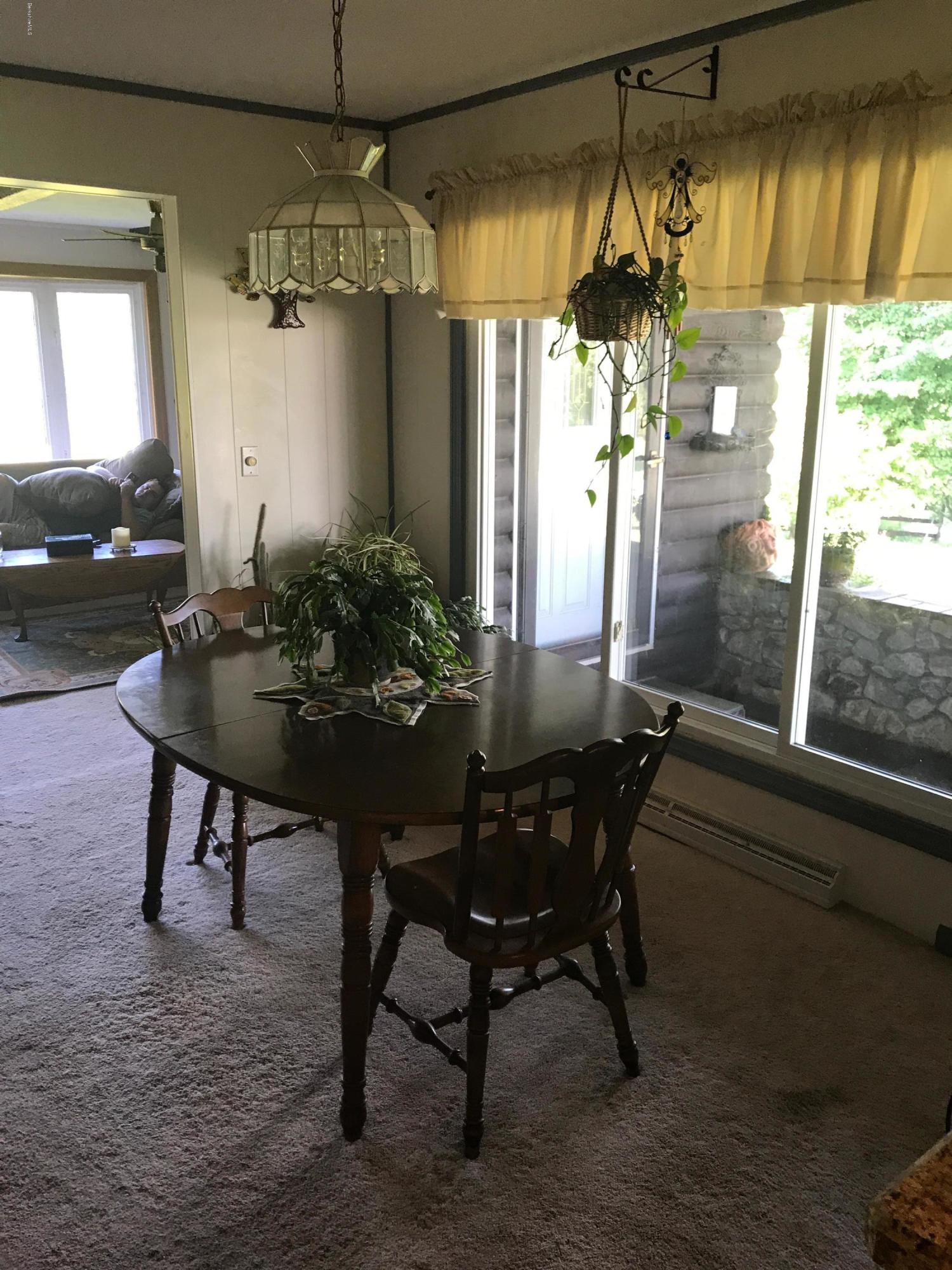 100 Jackson Road Savoy, MA 01256 - Photo 7 of 38 a view of a dining room with furniture and window