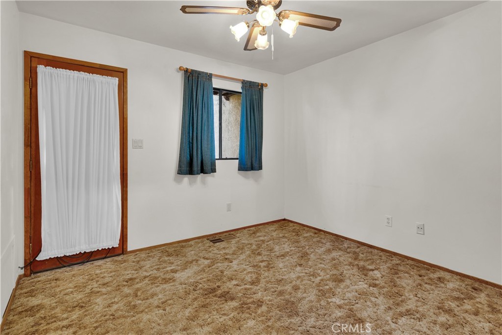 2471 Captains Walk Bradley, CA 93426 - Photo 18 of 42 a view of an empty room with wooden floor and a window