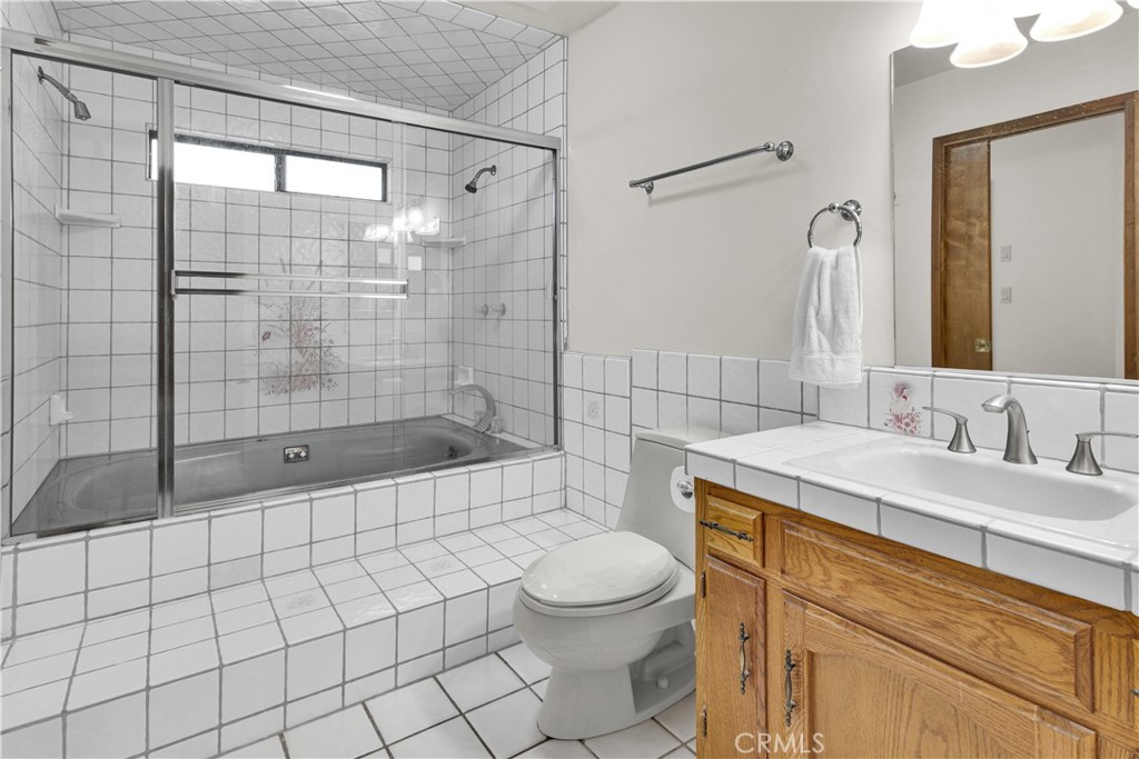 2471 Captains Walk Bradley, CA 93426 - Photo 20 of 42 a bathroom with a sink a toilet and shower