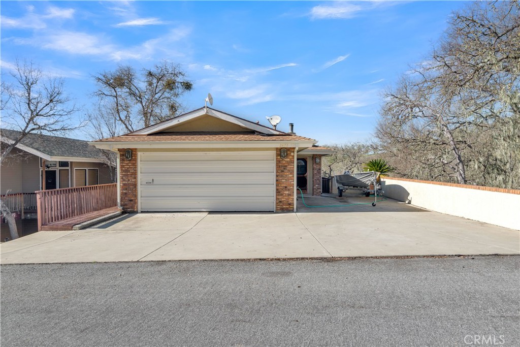 2471 Captains Walk Bradley, CA 93426 - Photo 2 of 42 a front view of a house with a yard and garage