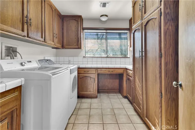 a utility room with a sink washer and dryer