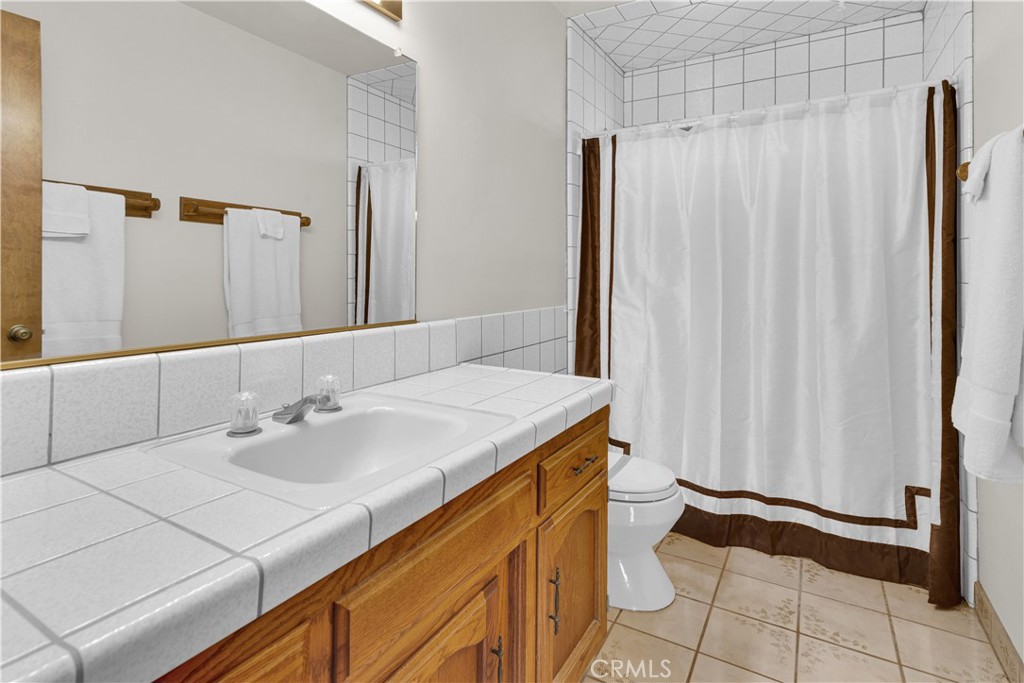 2471 Captains Walk Bradley, CA 93426 - Photo 7 of 42 a bathroom with a sink and a mirror