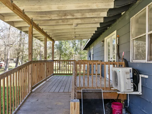 a view of balcony with wooden floor