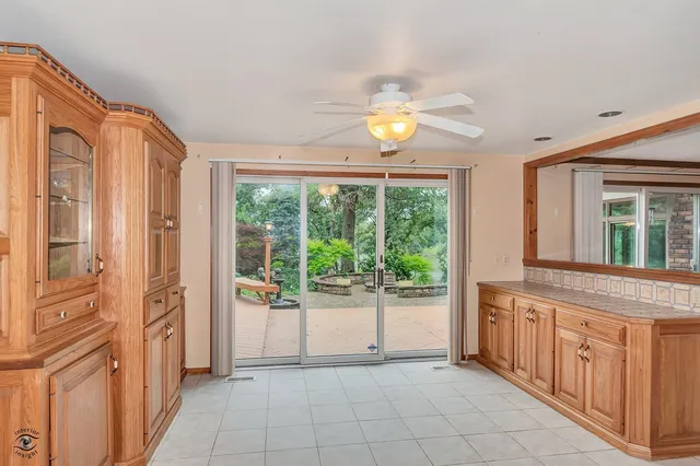 a view of empty room with wooden floor and fireplace