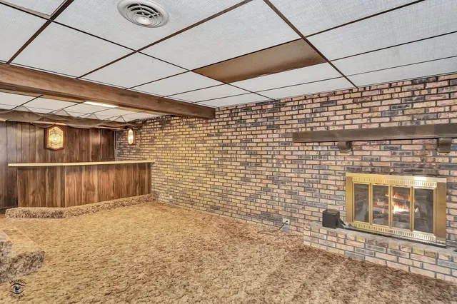 a view of an empty room with a window and balcony