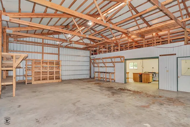 a view of a lake with a yard and trees