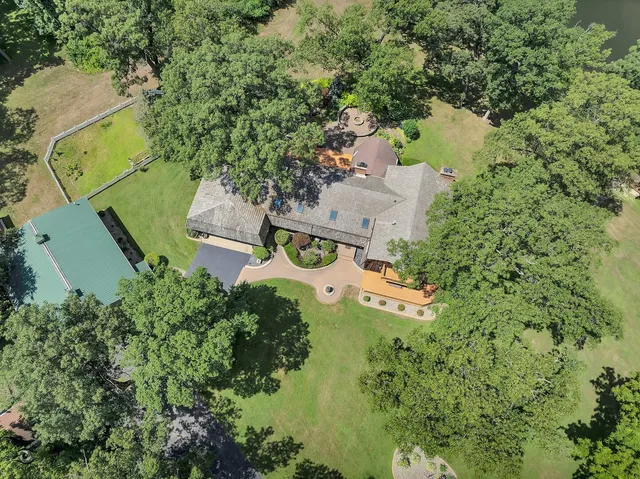 a view of a house with swimming pool and sitting area