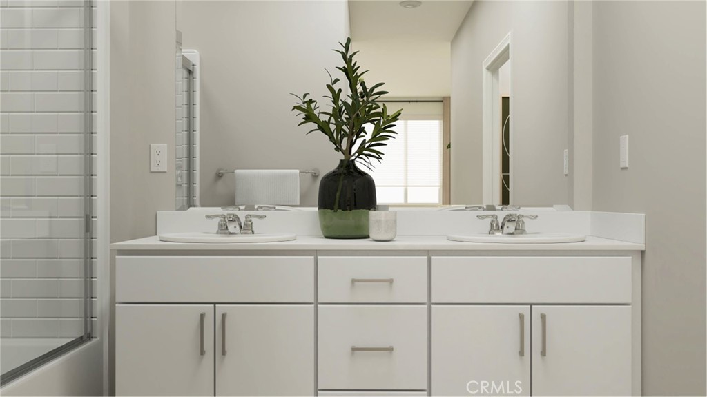 351 Deer Lane Way Perris, CA 92570 - Photo 11 of 15 a bathroom with a sink a mirror and a potted plant