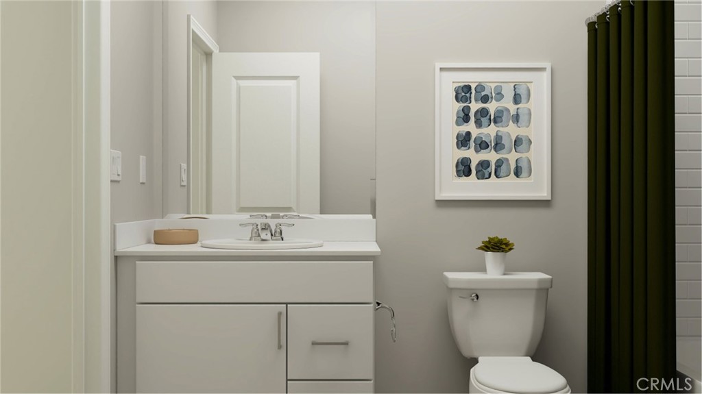351 Deer Lane Way Perris, CA 92570 - Photo 7 of 15 a bathroom with a toilet sink and mirror