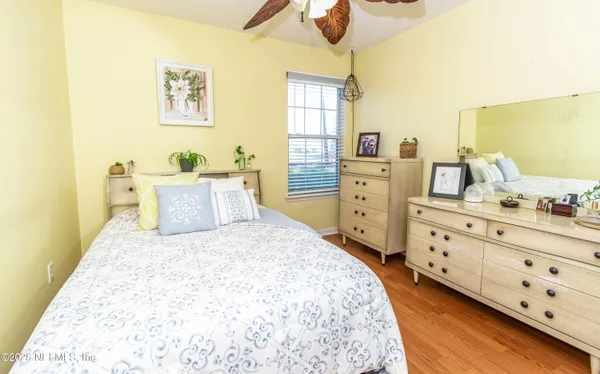 a bedroom with a bed and a dresser