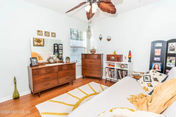 a bed room with a bed and a dresser