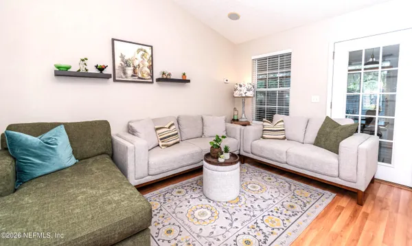a living room with furniture and windows