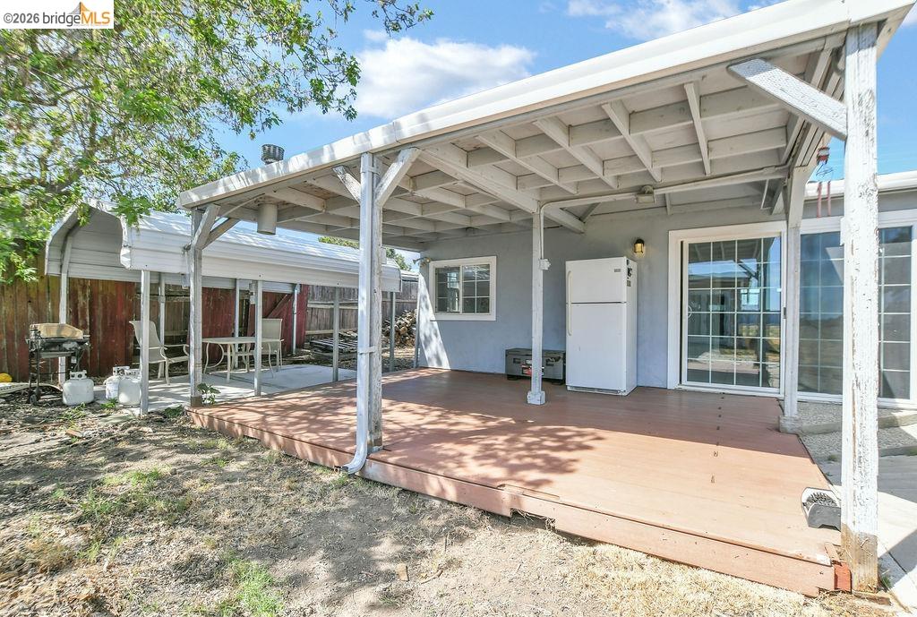 2191 East Cypress Road Oakley, CA 94561 - Photo 23 of 48 Back of house featuring stucco siding and a wooden deck