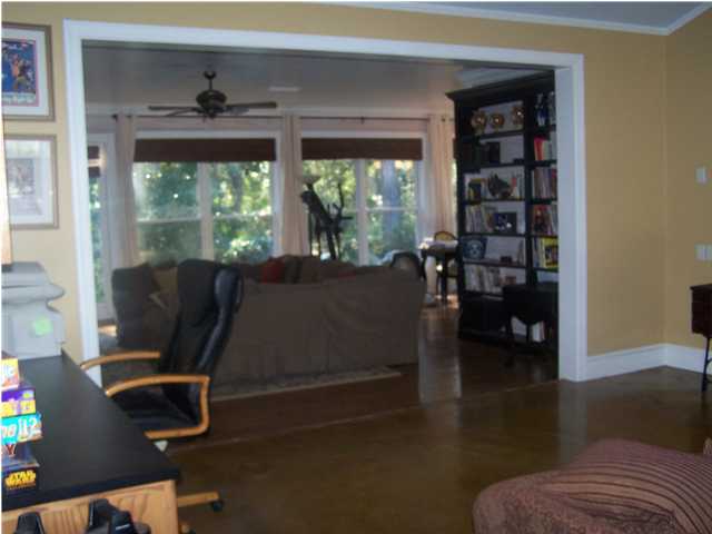 899 Bay Grove Road Freeport, FL 32439 - Photo 14 of 27 a living room with furniture and a floor to ceiling window