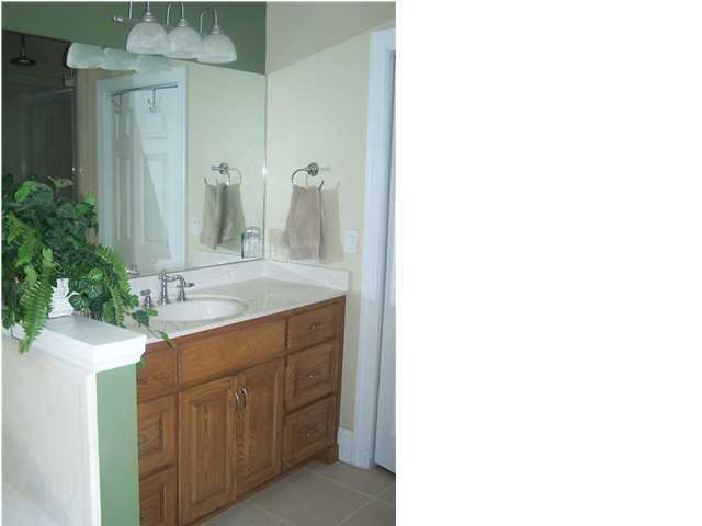 899 Bay Grove Road Freeport, FL 32439 - Photo 22 of 27 a bathroom with a sink and a mirror