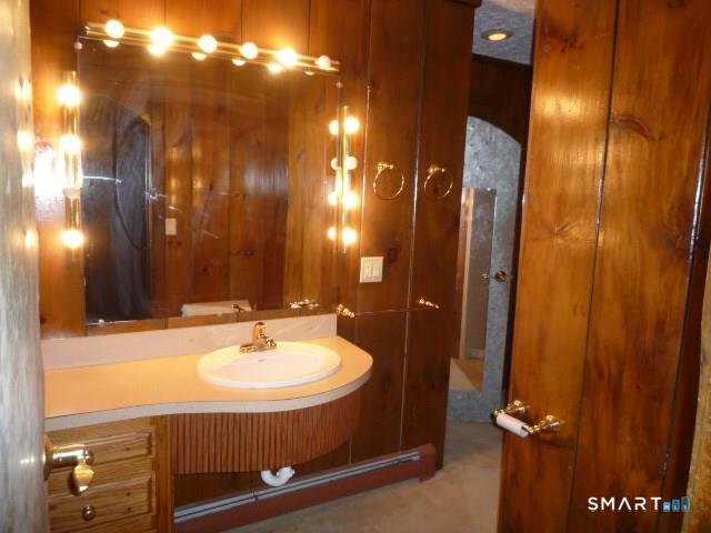 22 Broad Street Groton, CT 06340 - Photo 8 of 14 a bathroom with a sink and mirror