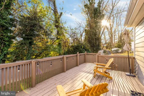a view of a balcony with wooden floor and outdoor space