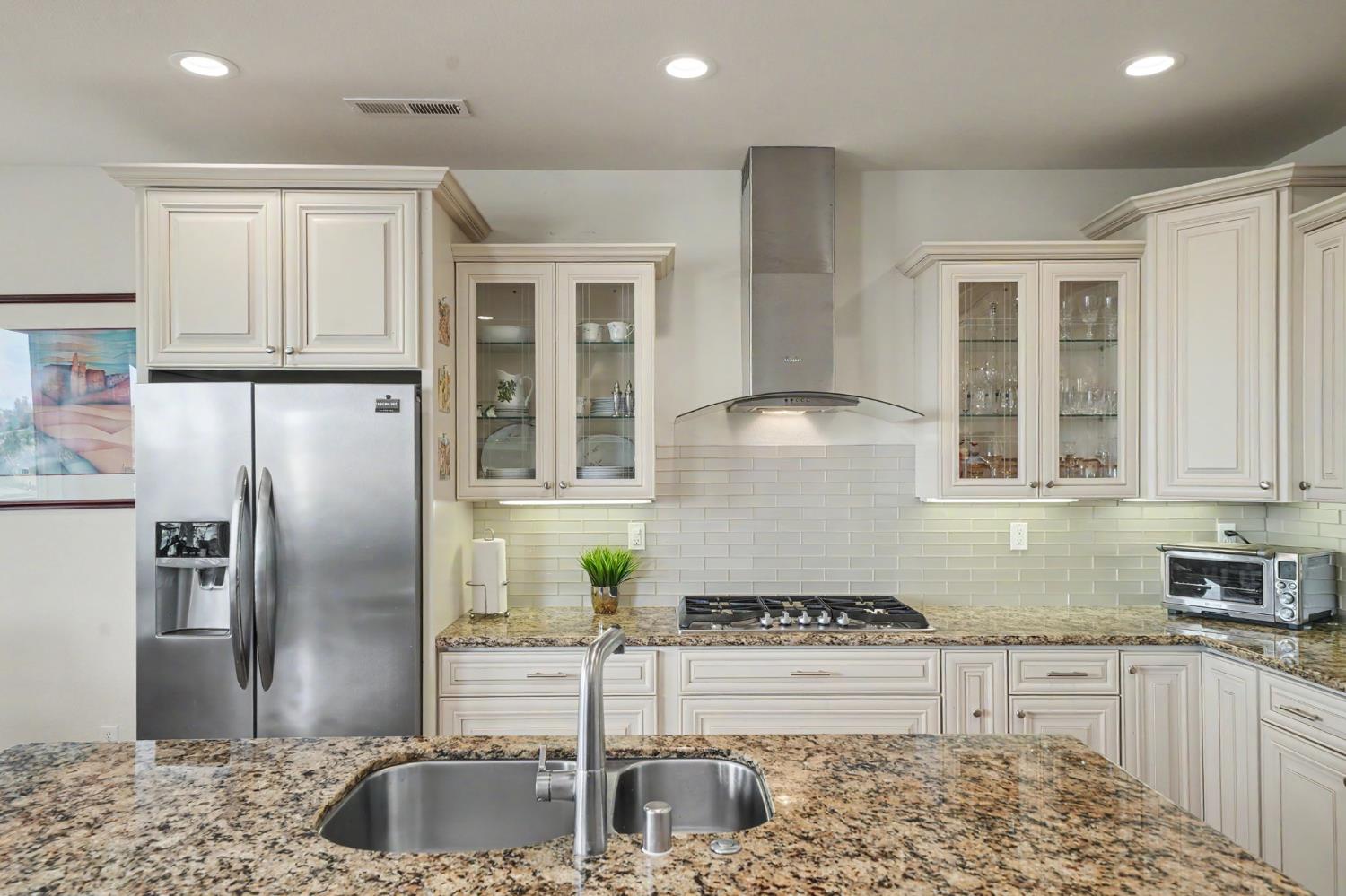 6066 Bluff View Road Copperopolis, CA 95228 - Photo 37 of 96 a kitchen with stainless steel appliances granite countertop a sink stove and refrigerator
