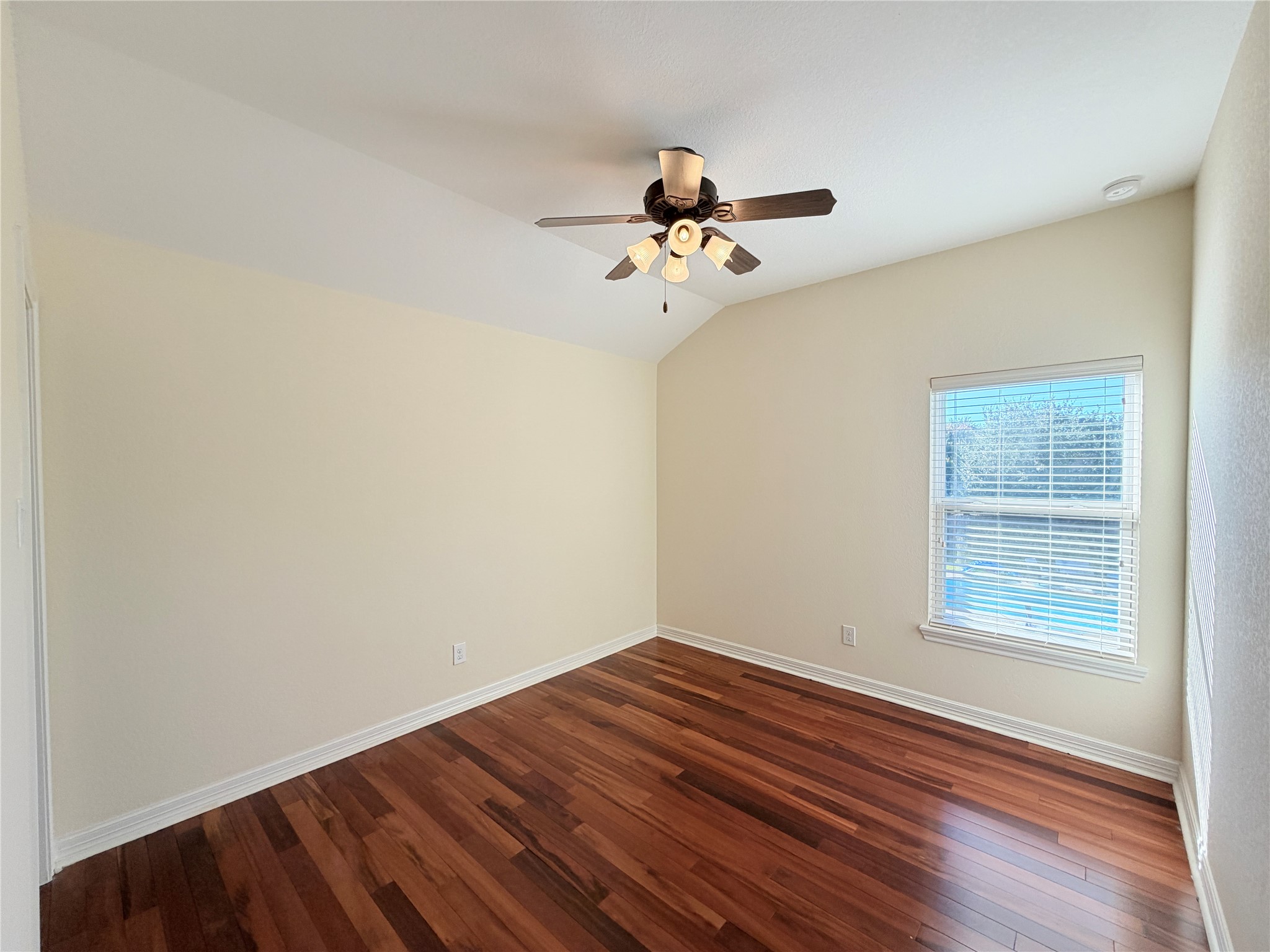 28015 Silverstream Court Fulshear, TX 77441 - Photo 26 of 33 a view of a room with wooden floor and fan