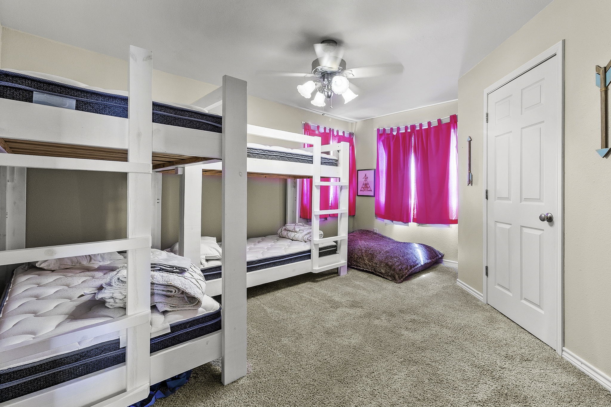 536 Weavers Cove Road Livingston, TX 77351 - Photo 24 of 44 a bedroom with furniture and a chandelier
