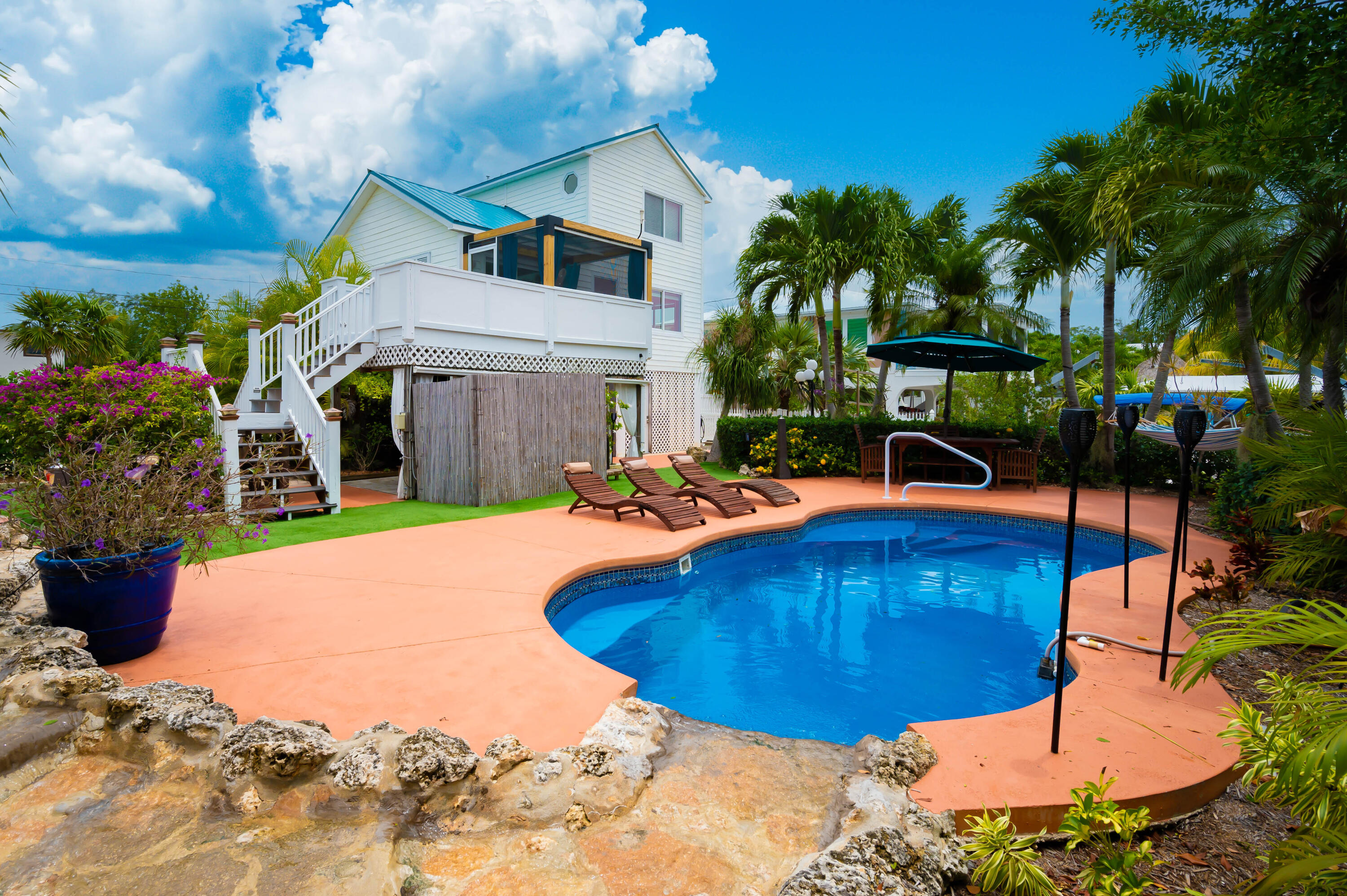 29072 Cedar Drive Big Pine Key, FL 33043 - Photo 20 of 59 a view of a backyard with plants and patio