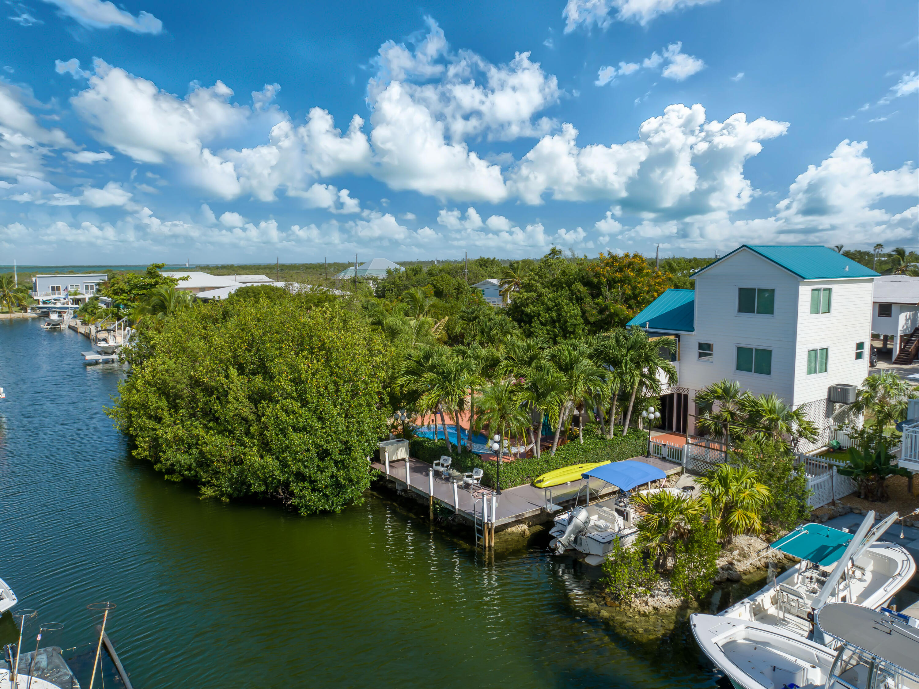 29072 Cedar Drive Big Pine Key, FL 33043 - Photo 2 of 59 a view of a lake with a house in the background