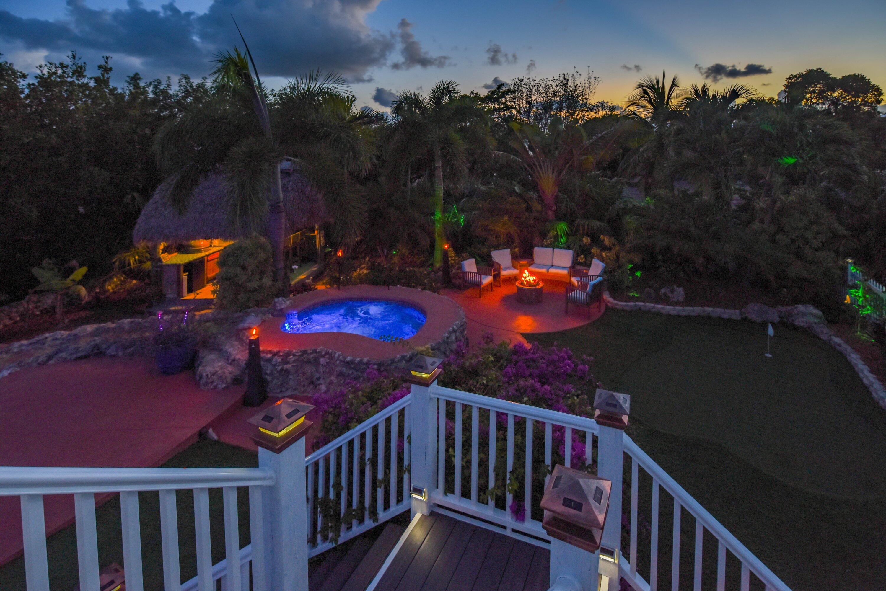 29072 Cedar Drive Big Pine Key, FL 33043 - Photo 39 of 59 a view of a fire pit with a swimming pool and outdoor seating