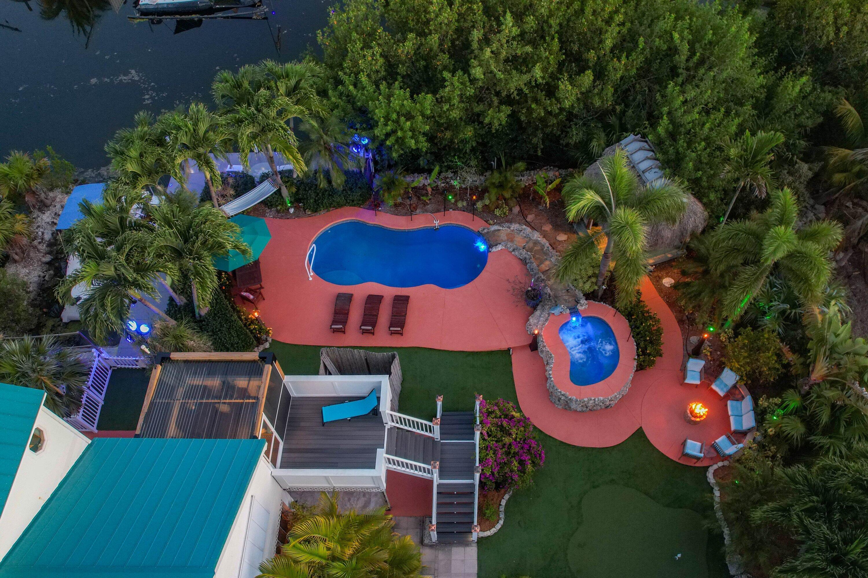 29072 Cedar Drive Big Pine Key, FL 33043 - Photo 40 of 59 a view of a house with swimming pool and furniture