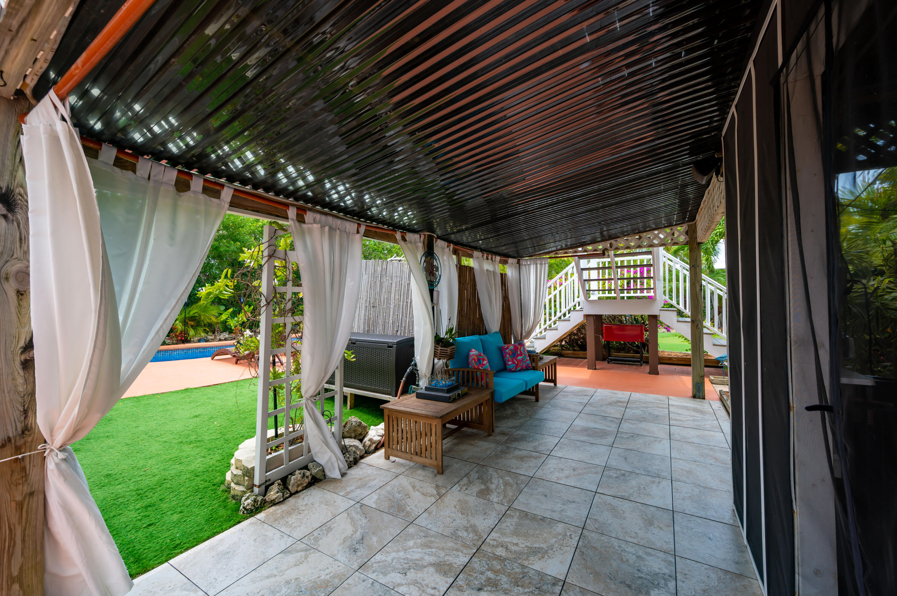 29072 Cedar Drive Big Pine Key, FL 33043 - Photo 48 of 59 a view of a porch with chairs and backyard