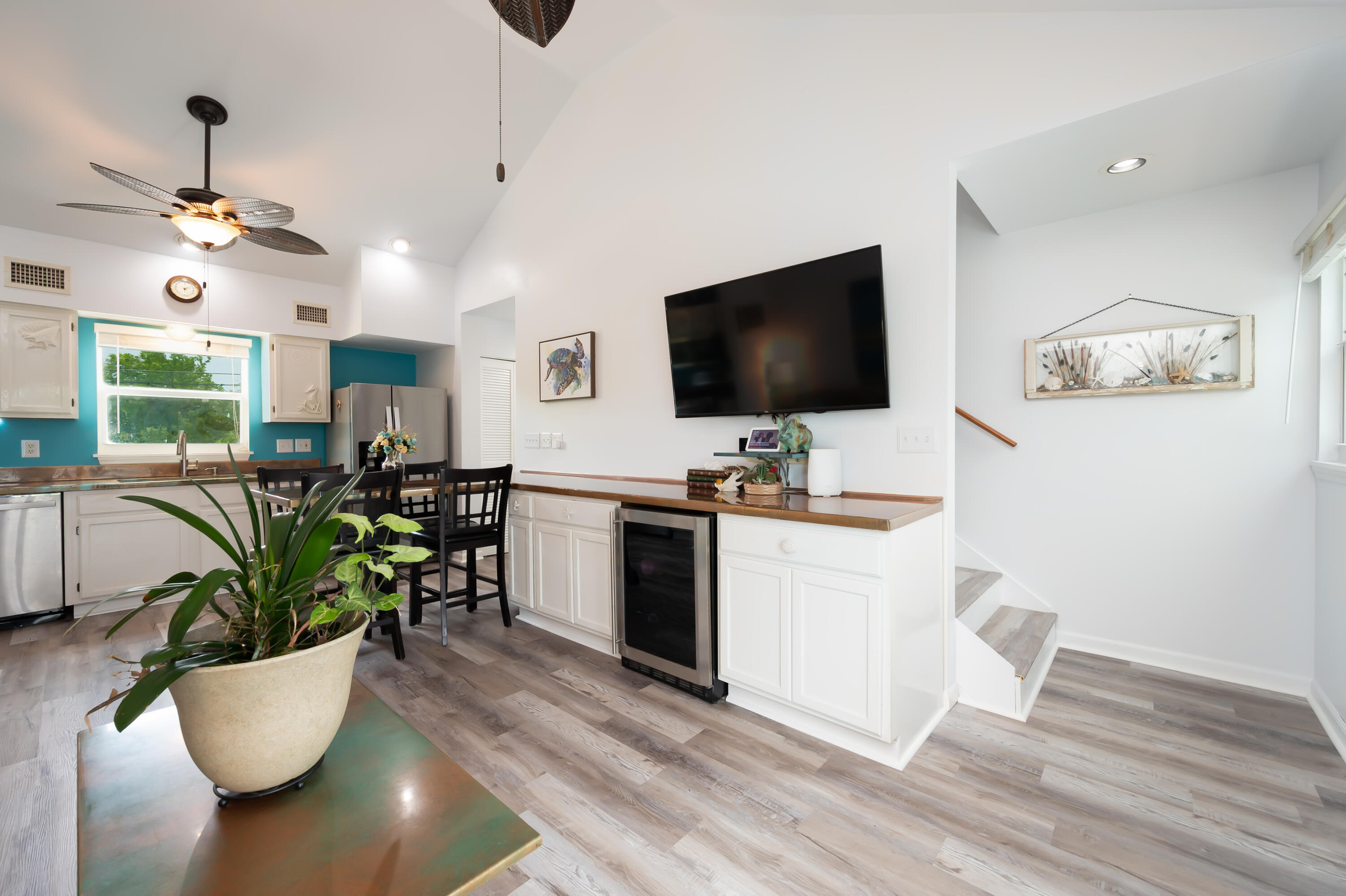 29072 Cedar Drive Big Pine Key, FL 33043 - Photo 8 of 59 a living room with furniture a flat screen tv and a floor to ceiling window