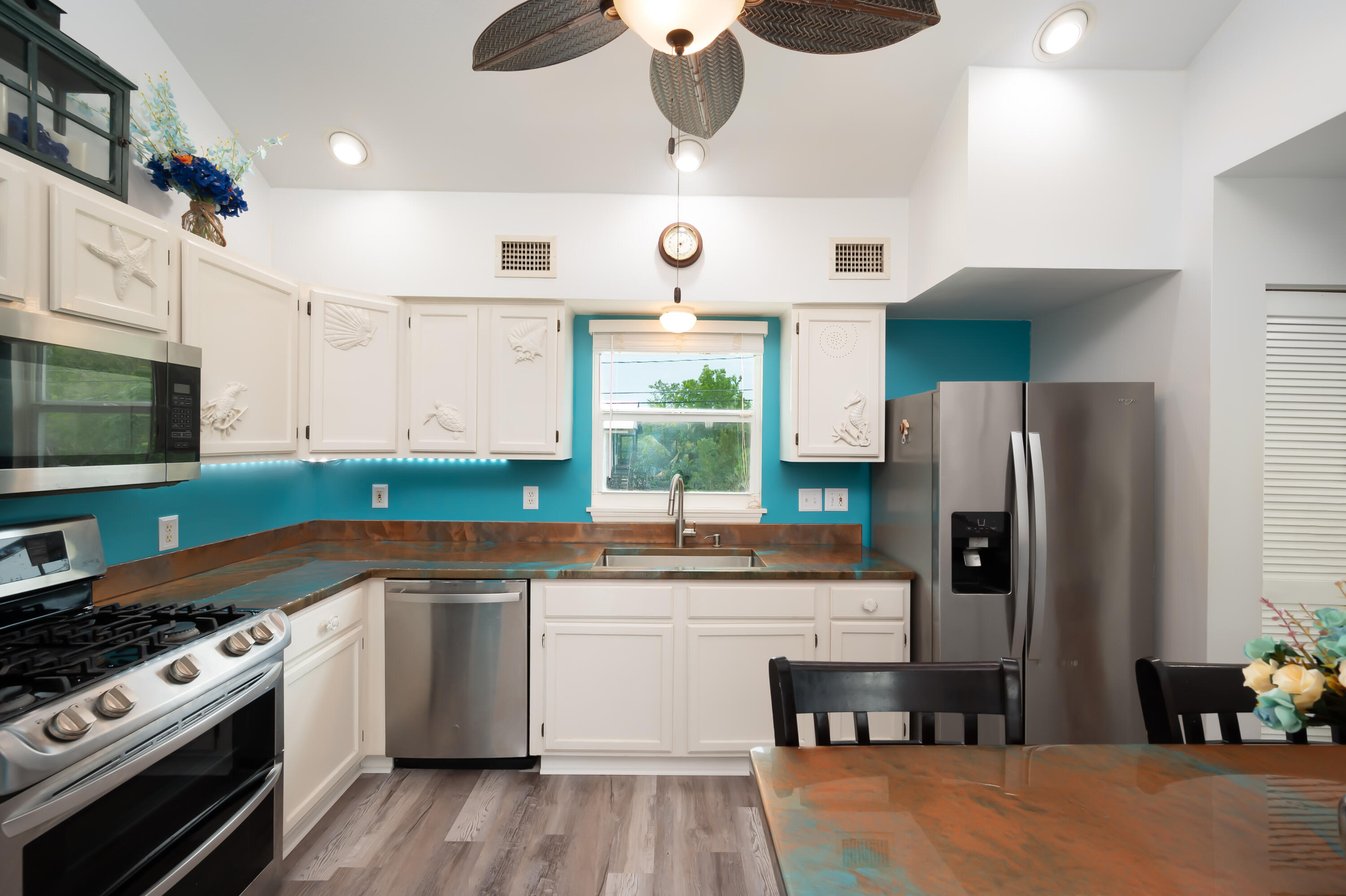 29072 Cedar Drive Big Pine Key, FL 33043 - Photo 10 of 59 a kitchen with stainless steel appliances a sink stove and refrigerator