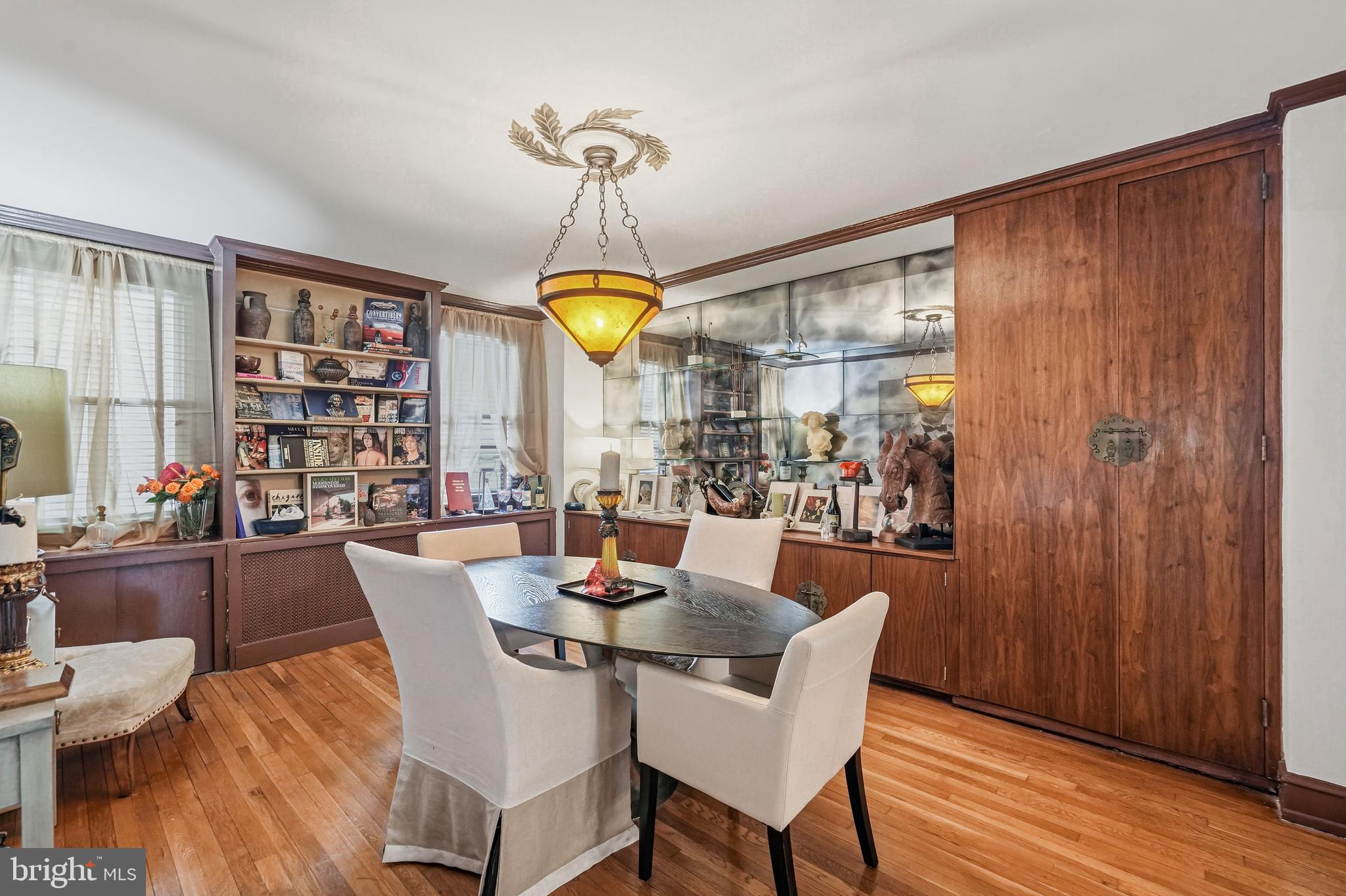 1901 Walnut Street, Unit 6F Philadelphia, PA 19103 - Photo 11 of 32 a view of a dining room with furniture window and wooden floor