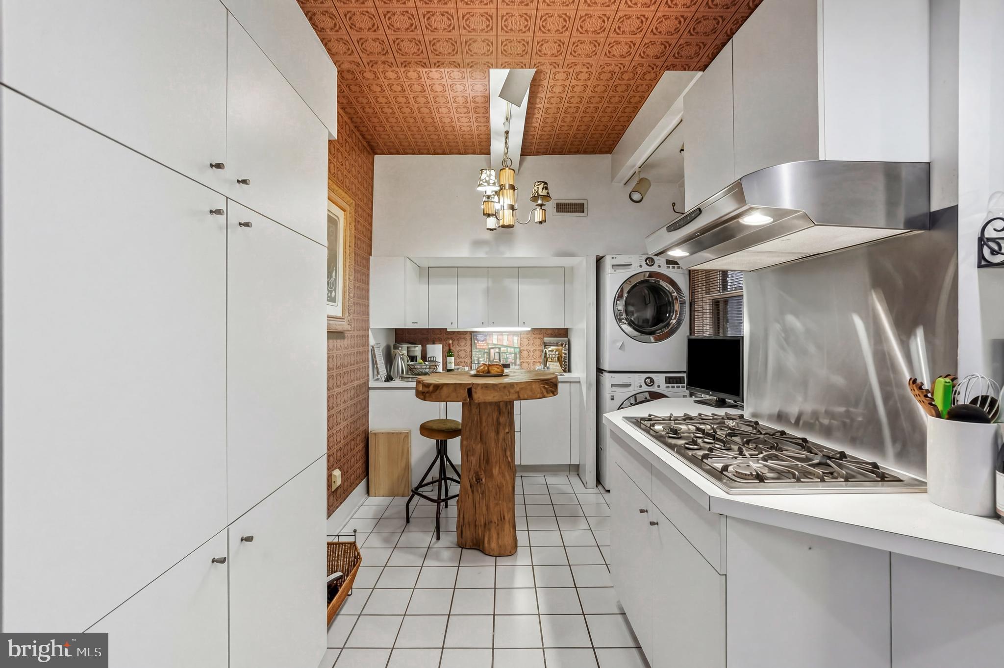 1901 Walnut Street, Unit 6F Philadelphia, PA 19103 - Photo 13 of 32 a kitchen with stainless steel appliances granite countertop a sink stove and refrigerator