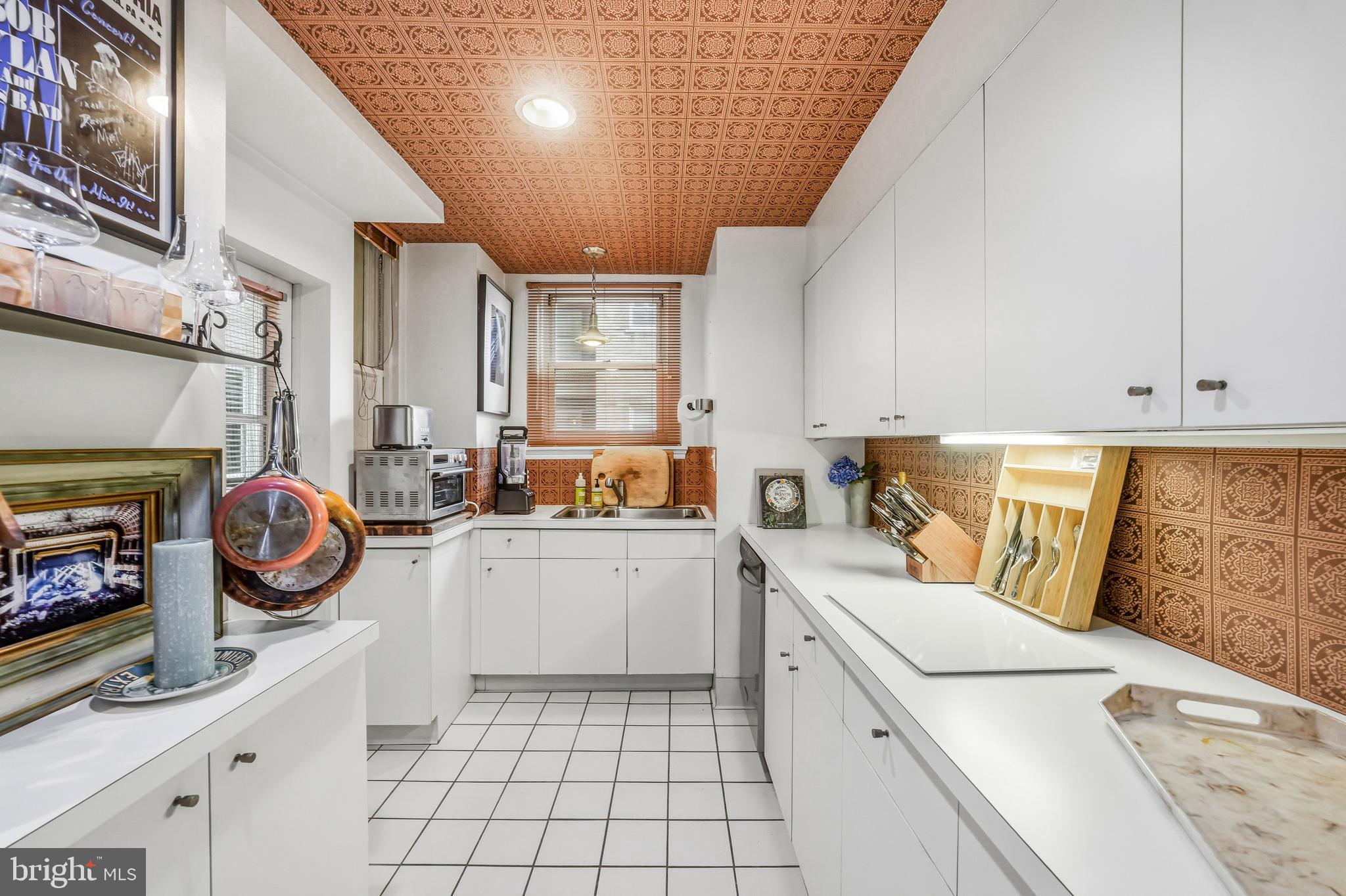 1901 Walnut Street, Unit 6F Philadelphia, PA 19103 - Photo 14 of 32 a utility room with sink dryer and washer