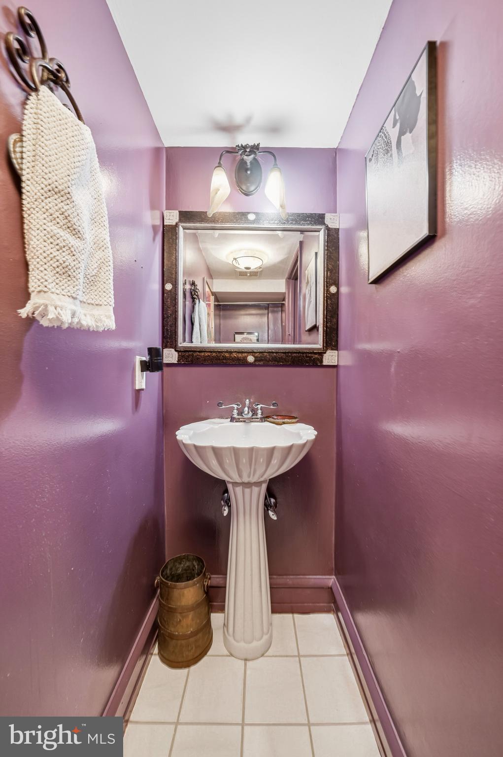 1901 Walnut Street, Unit 6F Philadelphia, PA 19103 - Photo 17 of 32 a bathroom with a sink a mirror and a shower