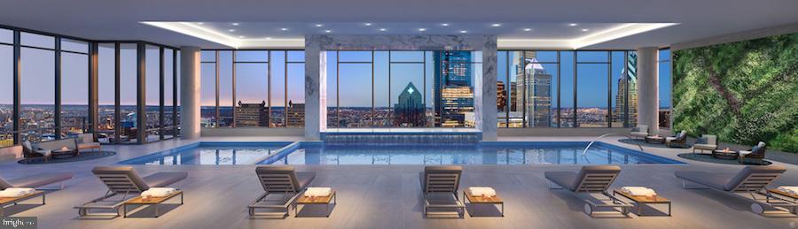 1901 Walnut Street, Unit 6F Philadelphia, PA 19103 - Photo 26 of 32 a living room with furniture and a large window