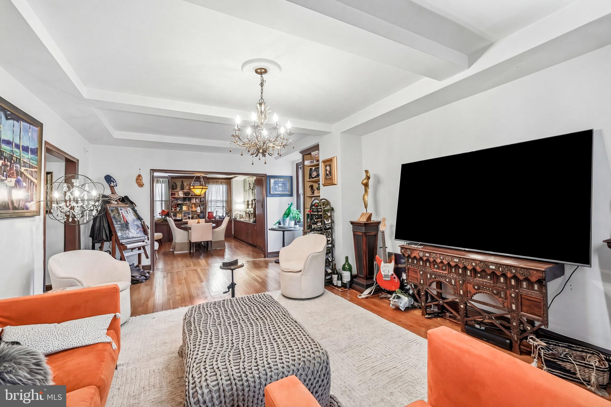 1901 Walnut Street, Unit 6F Philadelphia, PA 19103 - Photo 7 of 32 a living room with furniture and a flat screen tv