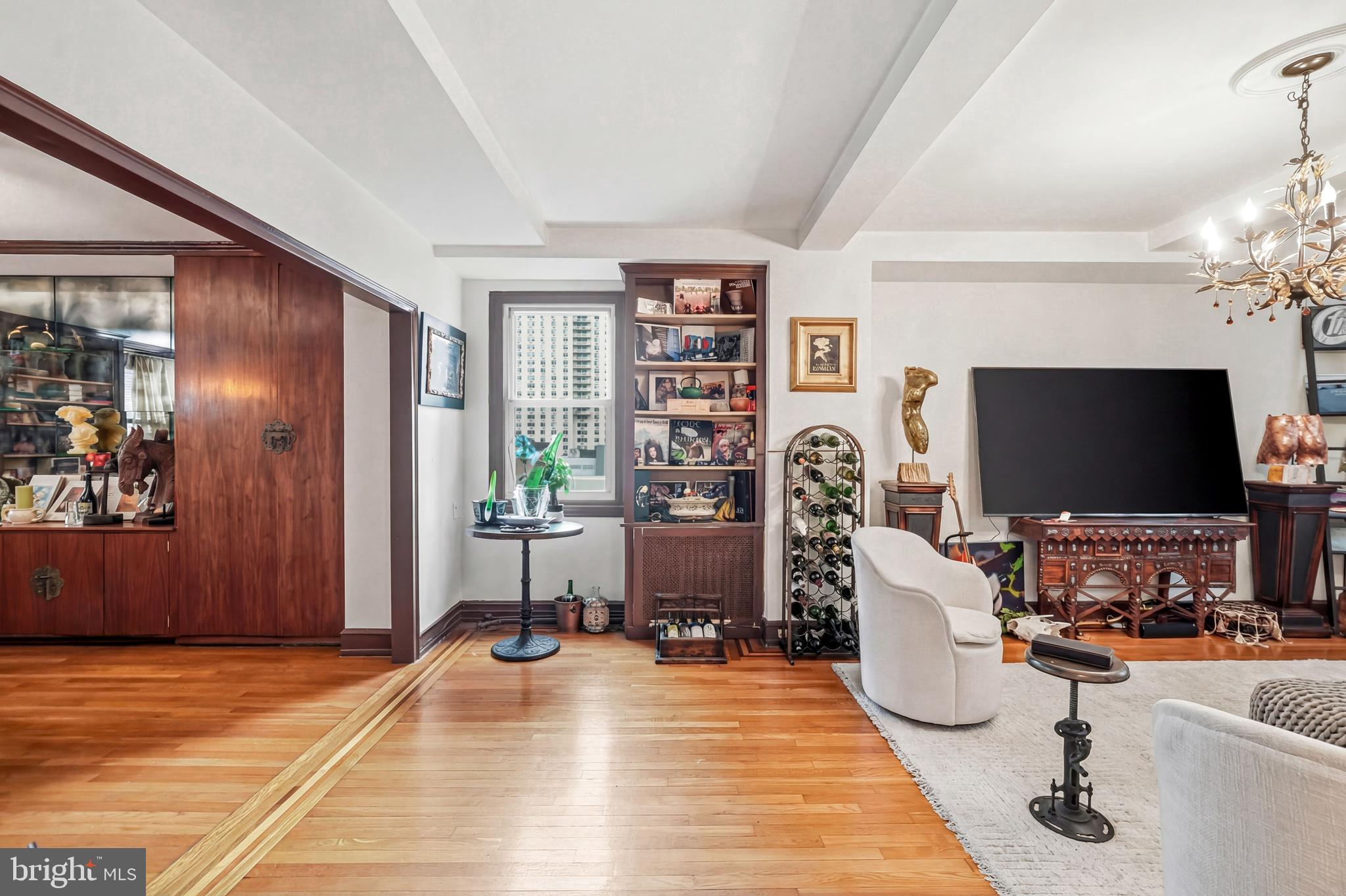 1901 Walnut Street, Unit 6F Philadelphia, PA 19103 - Photo 8 of 32 a living room with furniture and a flat screen tv