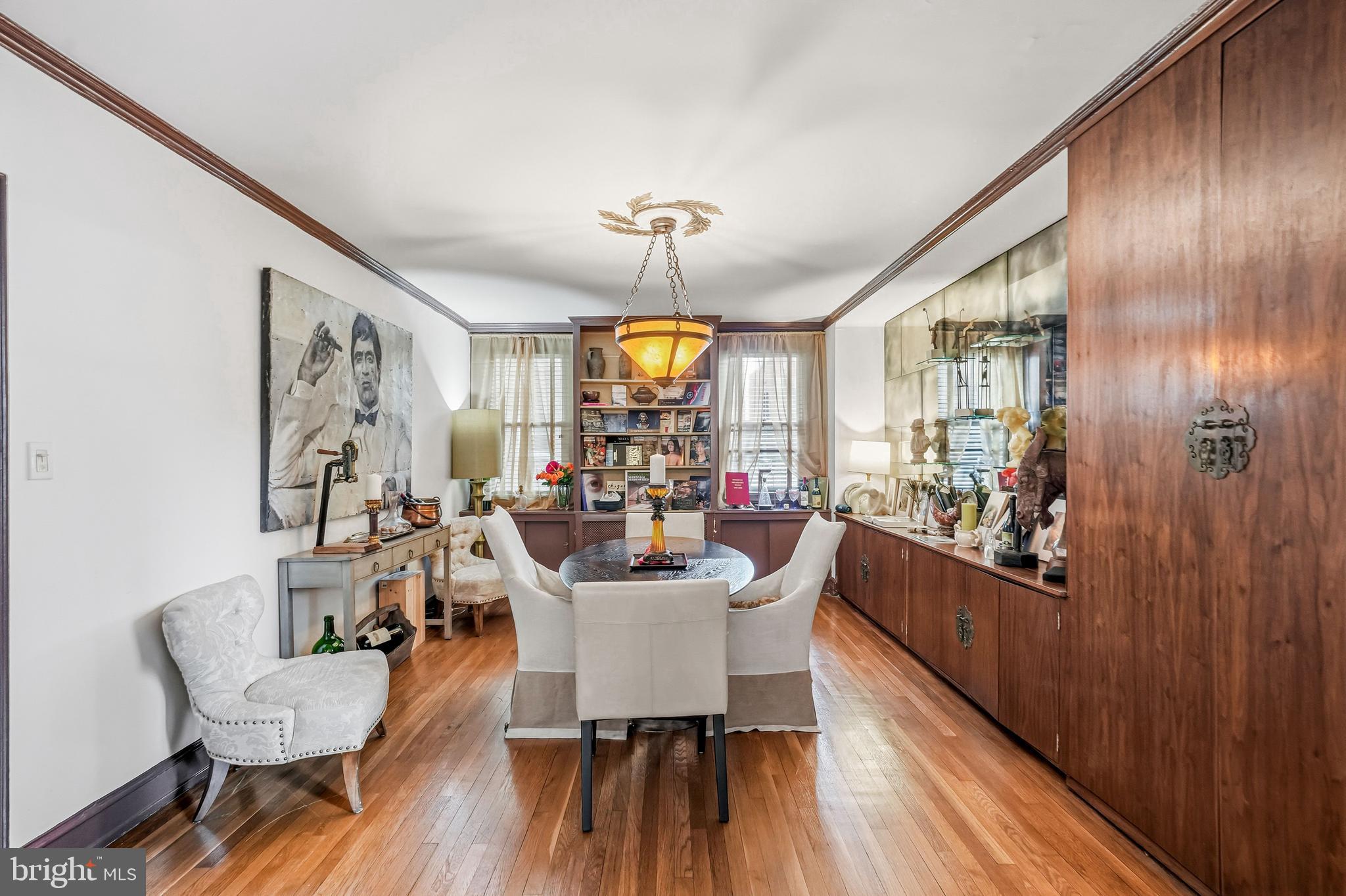 1901 Walnut Street, Unit 6F Philadelphia, PA 19103 - Photo 9 of 32 a view of a dining room with furniture window and wooden floor