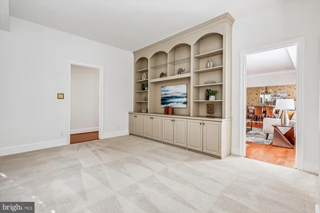 a view of kitchen with cabinet and windows