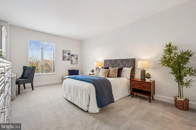 a spacious bedroom with a bed and a couch